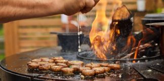 Man grilling hamburgers on a barbecue