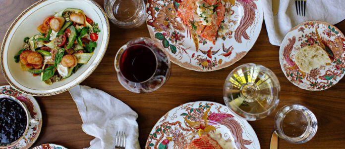 Plates of different foods and cups of tea at Naramata Inn