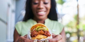 Woman eating a chicken sandwich