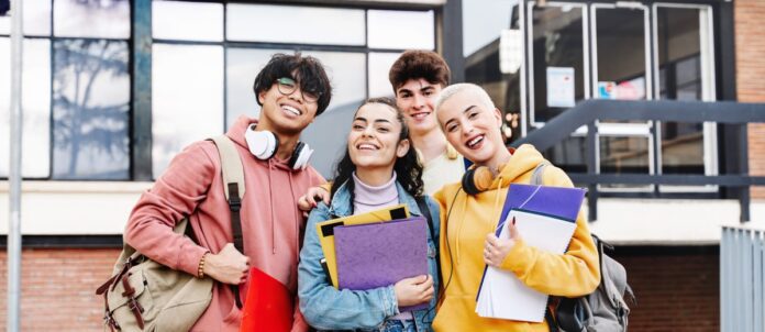 Group of university student posing for photo on campus