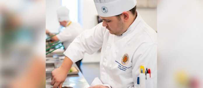 Ethan Green preparing a dish