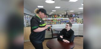 7-Eleven worker taking a customers order