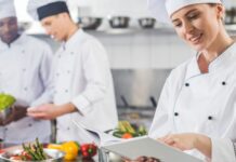Chefs preparing a meal in a commercial kitchen