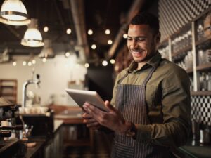 foodservice worker reading on ipad