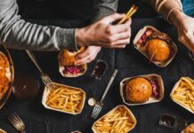 A group of friends eating fast food together