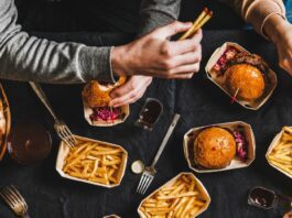 A group of friends eating fast food together