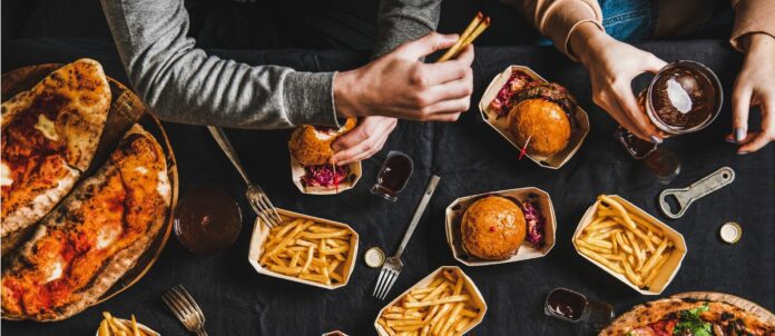 A group of friends eating fast food together