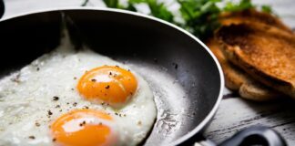 Over easy eggs in a frying pan
