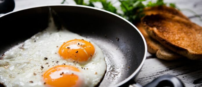 Over easy eggs in a frying pan