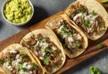 Homemade Pork Carnitas Tacos with Cilantro and Onion