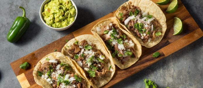 Homemade Pork Carnitas Tacos with Cilantro and Onion