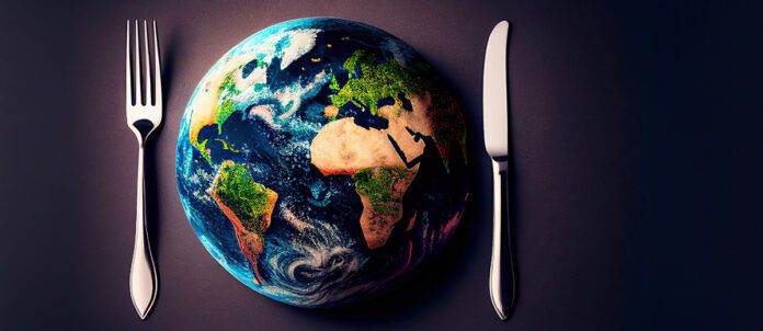 Knife and Fork with planet Earth in middle of table
