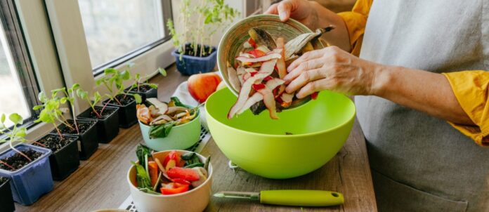 Woman chef pouring peeled apple skins into bowl