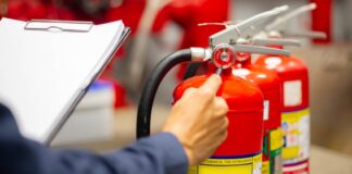 Engineer Checking Fire Extinguisher and Preforming Safety Check