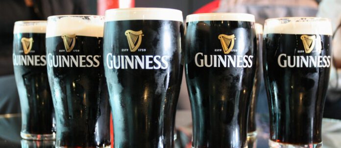 Pints of Guinness at Bar in Beer Glasses