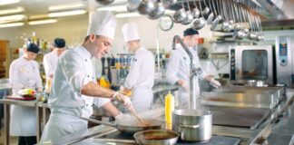 Chefs preparing meals in a restaurant's kitchen