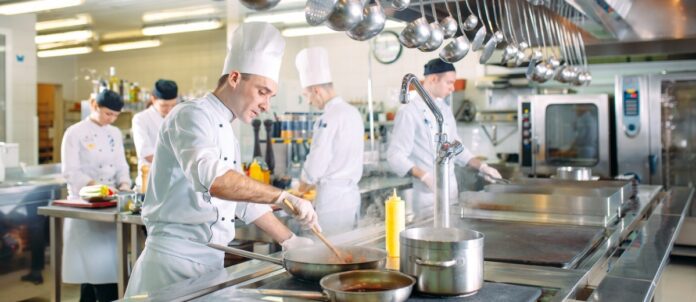 Chefs preparing meals in a restaurant's kitchen