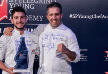 Chef Nelson Freitas holding Best Young Chef in the World Award at S. Pellegrino Young Chef Academy 2023 event