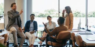 Group of corporate employees collaborating together in office