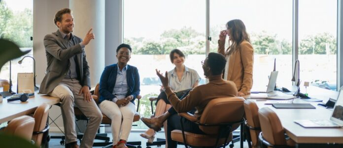 Group of corporate employees collaborating together in office