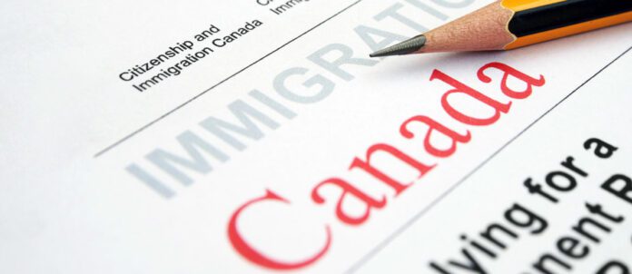 Canadian Immigration form with pencil on top of document
