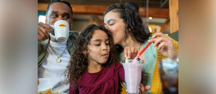 Husband and Wife enjoying denny's restaurant