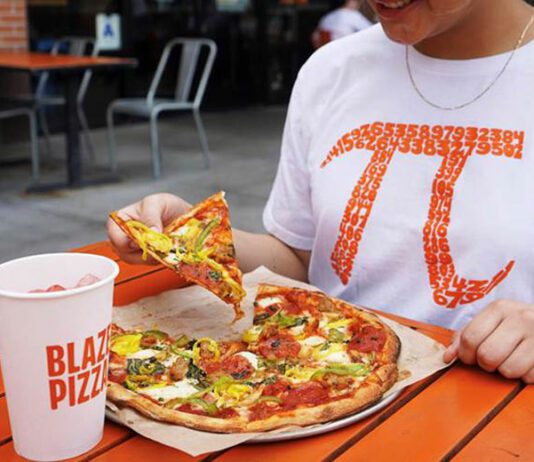 Blaze Pizza customer enjoying pizza on Pi Day
