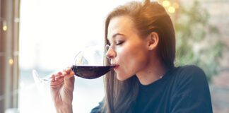 Woman drinking a glass of red wine