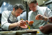 Chef John-Vincent Troiano of FRILU and chef Joel Gray of Down Home collaborate on a dish featured at the inaugural A Taste of the Future dining event, presented by Mercedes-Benz in partnership with The MICHELIN Guide. (CNW Group/Mercedes-Benz Canada Inc.)