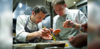 Chef John-Vincent Troiano of FRILU and chef Joel Gray of Down Home collaborate on a dish featured at the inaugural A Taste of the Future dining event, presented by Mercedes-Benz in partnership with The MICHELIN Guide. (CNW Group/Mercedes-Benz Canada Inc.)