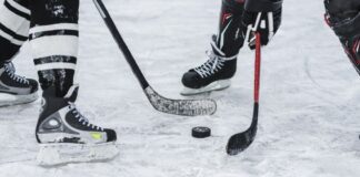Close-up of puck during hockey game faceoff