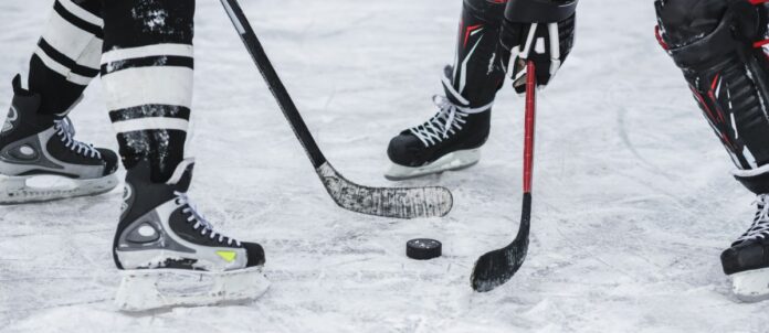 Close-up of puck during hockey game faceoff