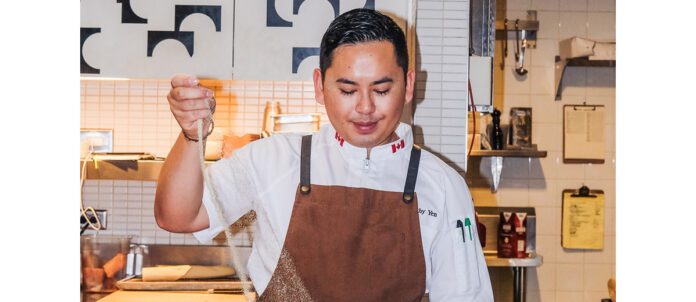 Photo of Chanthy Yen of Bacaro cooking at restaurant