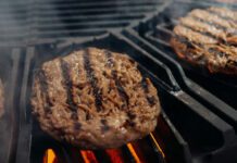 Hamburgers on grill being cooked