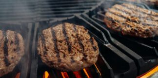 Hamburgers on grill being cooked