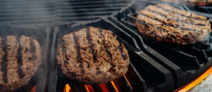 Hamburgers on grill being cooked