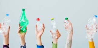 Hands holding plastic bottles