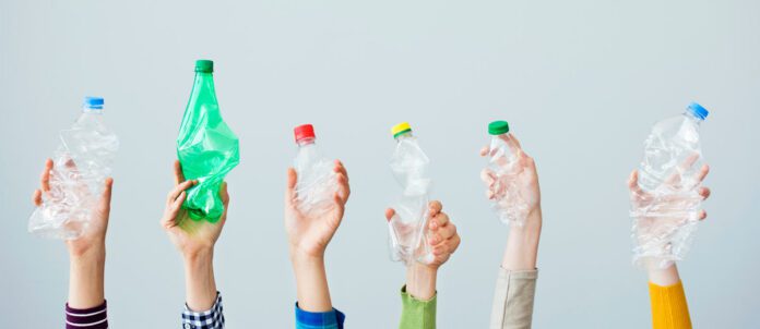 Hands holding plastic bottles