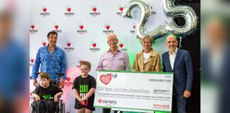 Pizza Nova's president Domenic Primucci donating cheque to The Children’s Charity of Ontario