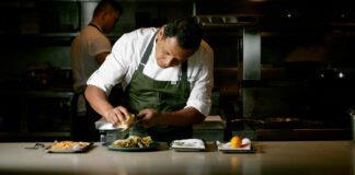 Chef Hector Laguna creating a gourmet caesar salad