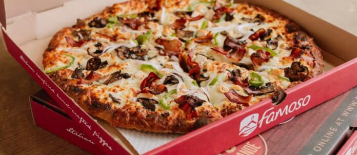 Famoso Pizzeria opened pizza box on a table