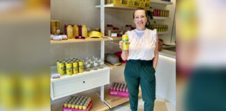 Jennie Dobbs holding Drink Sprizzi at Retail store