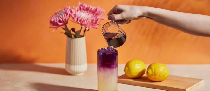 Tea being poured into a glass