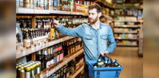 Customer purchasing wine at a convenience store
