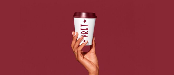 Woman holding Pret A Manger Coffee cup