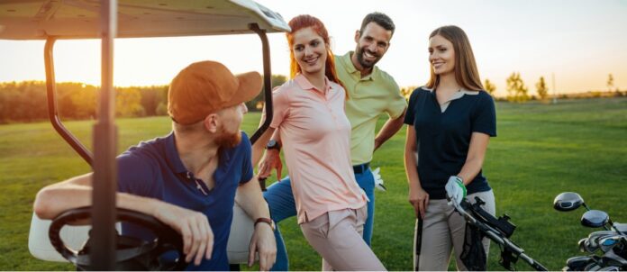 Group of friends golfing together on a sunny day