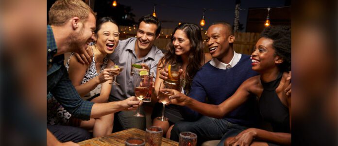 Group of friends drinking at a bar together