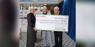 Pizza Nova President and CEO holding cheque to the Princess Margaret Cancer Foundation