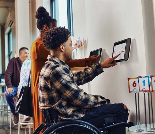 Man using a Square's Kiosk Check-out