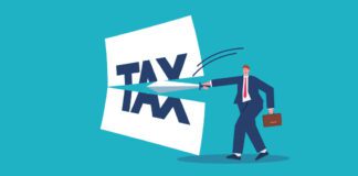 Businessman with a sword cuts the tax bill